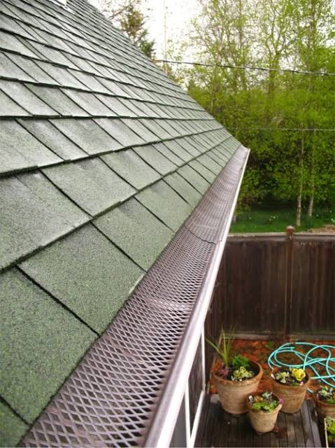 Gutter guard fitted to a roofline